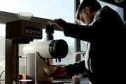 Image of Jamie grinding coffee